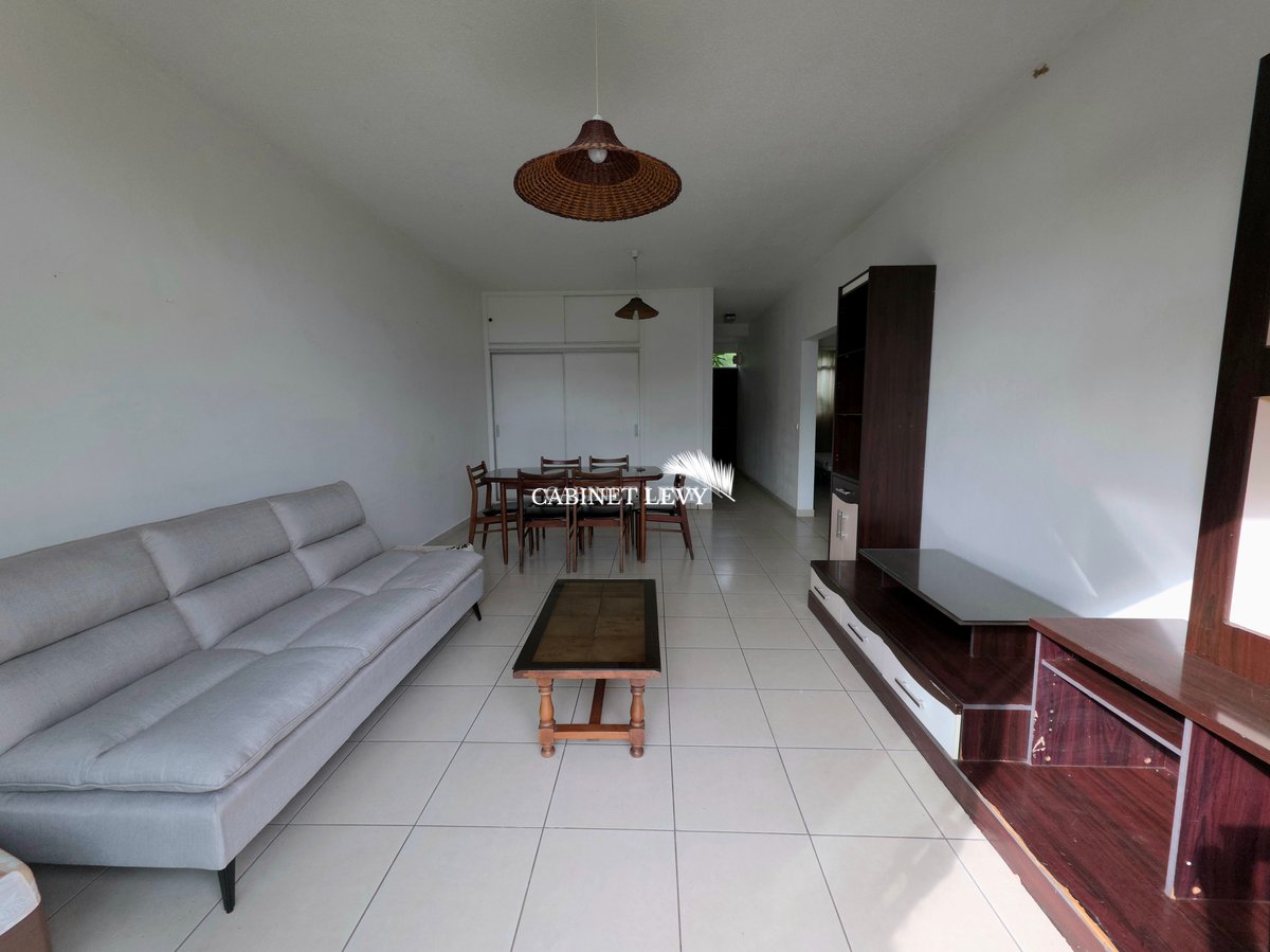 Appartement F3 au rez-de-jardin (Résidence bord de mer) à Arue - B14